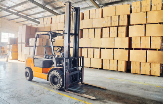 Large modern warehouse with forklifts